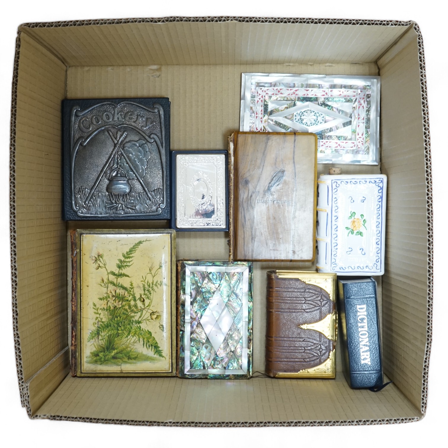 A small group of other assorted novelty bindings, including mother of pearl, leather and silver plate. Condition - varies